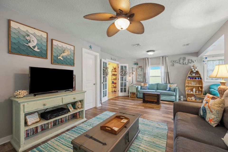 Bright living area with ample seating and Smart TV