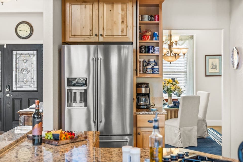Top of the line kitchen with stainless steel appliances and granite countertops.