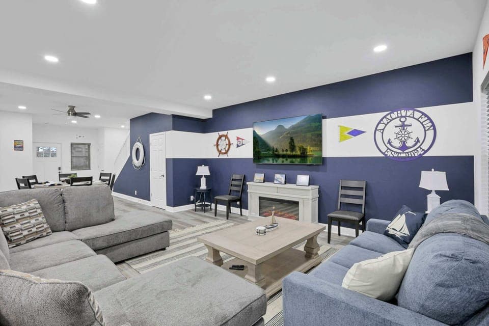 Cozy open-concept living room with a queen-sized pull-out sofa, perfect for relaxing or accommodating extra guests.