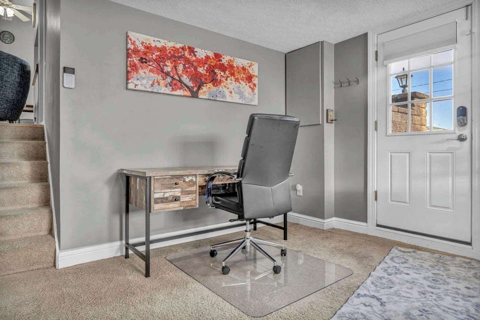 A dedicated office space with comfy seating.