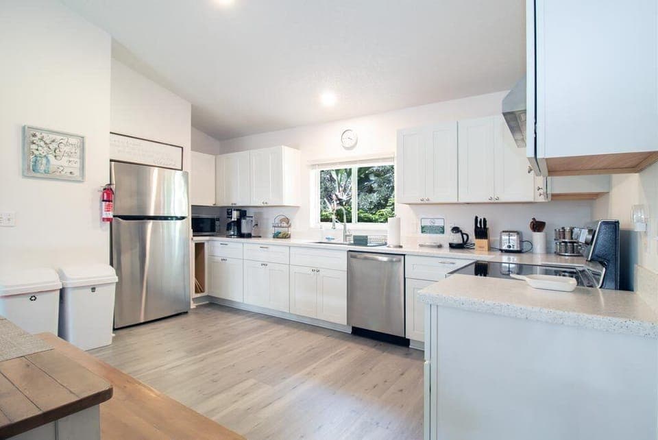 Full kitchen with fridge, dishwasher, oven, microwave, coffee maker & tea kettle