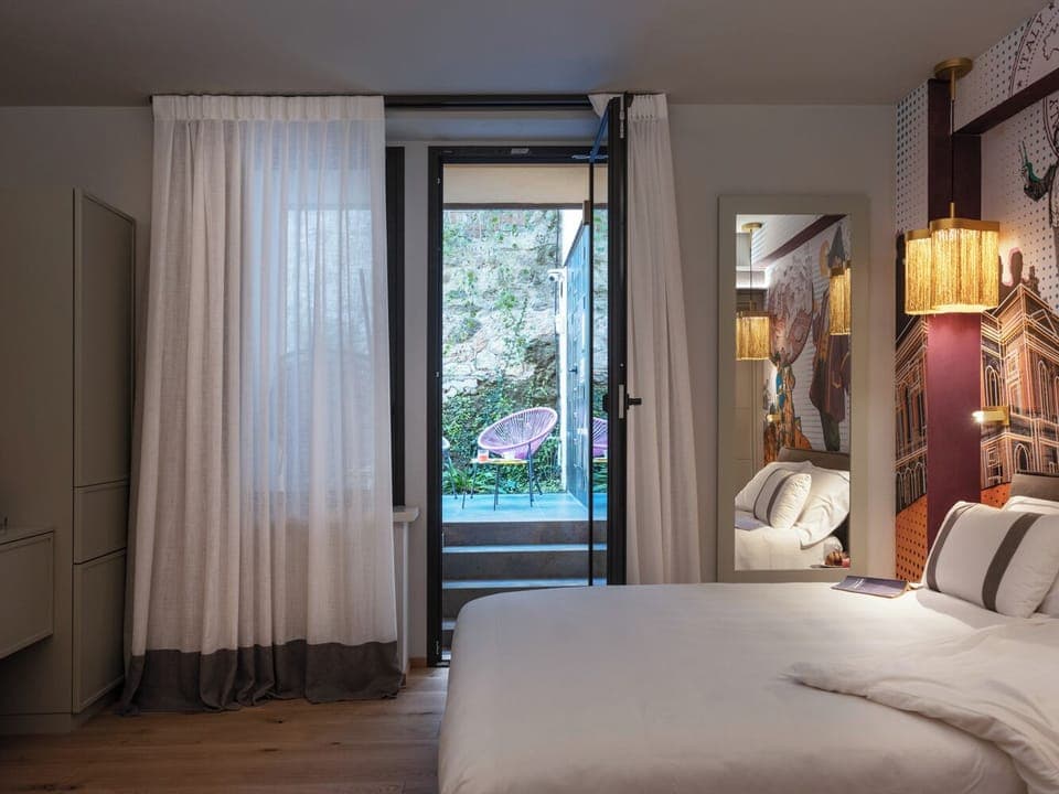 Deluxe Triple Room, Garden View | Minibar, in-room safe, blackout drapes, free WiFi