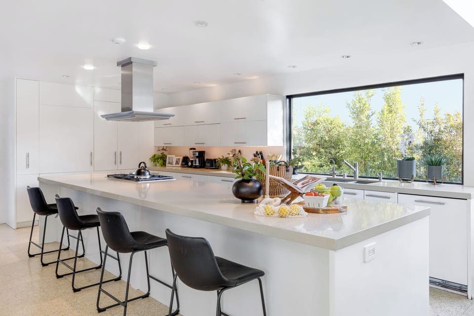 Additional barstool seating at the kitchen island.
