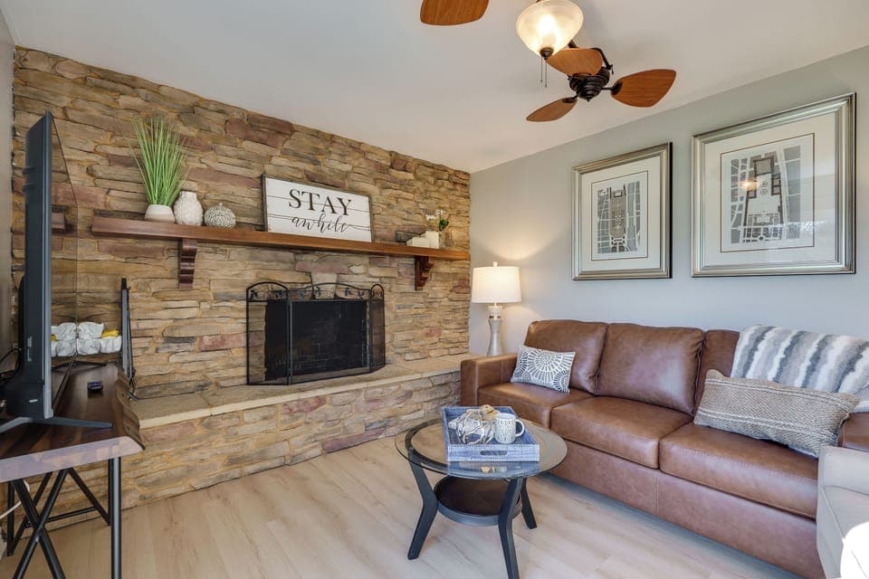 Family Room: Bright and cozy family room with plenty of space to relax, offering direct access to the fenced yard for outdoor fun.