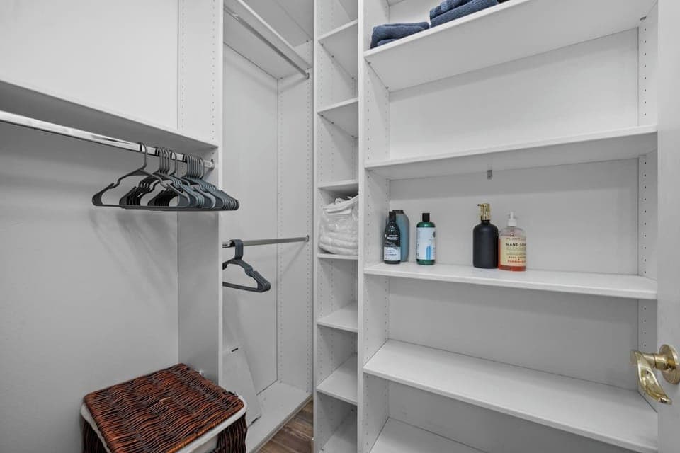 Clothing storage area with ample space for hanging and organizing your wardrobe, keeping your belongings neat and easily accessible.