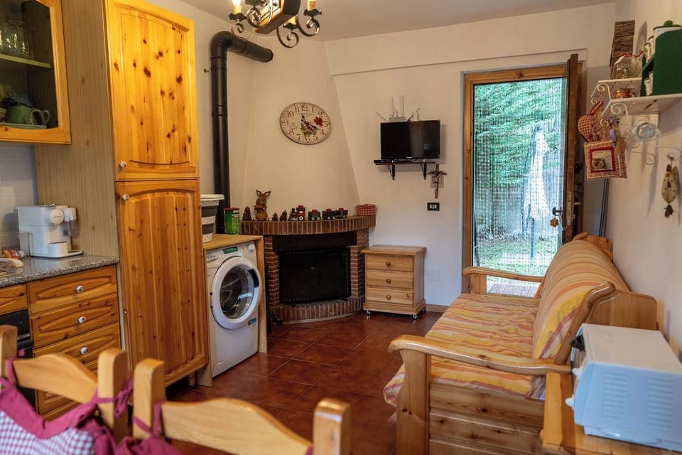 Apartment, Balcony, Garden View | Living area | 32-inch flat-screen TV with cable channels