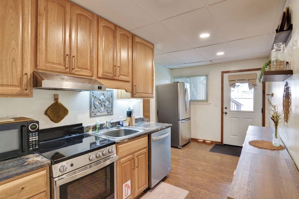 Fully equipped kitchen with small appliances including: blender, toaster, etc.