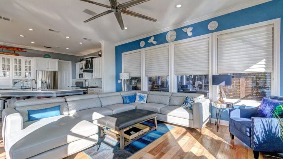 Your bright, coastal-inspired living room flows seamlessly into the modern kitchen, creating the perfect space for cooking and relaxing together.
