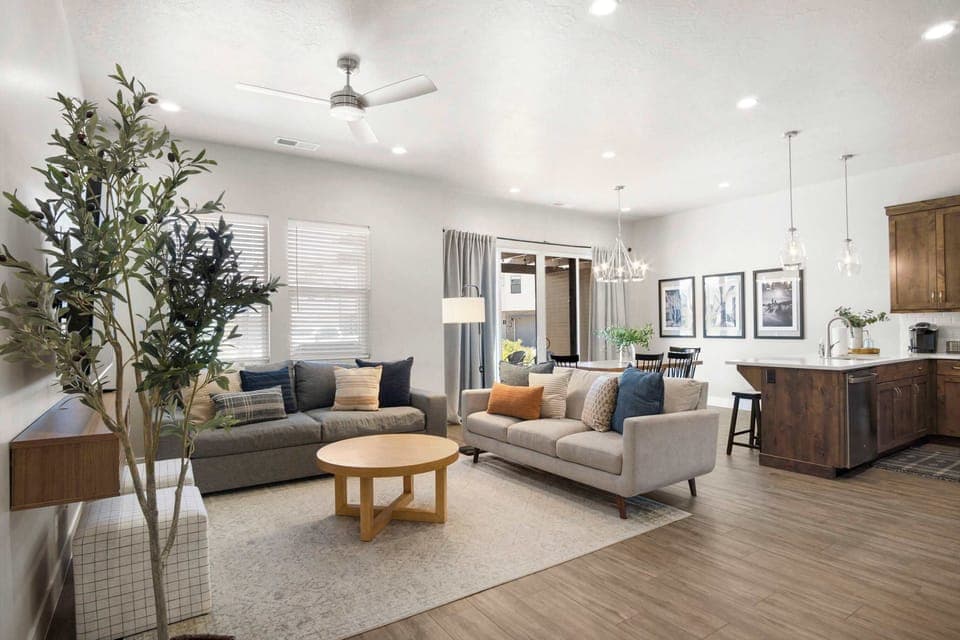 Modern spacious living area with TV