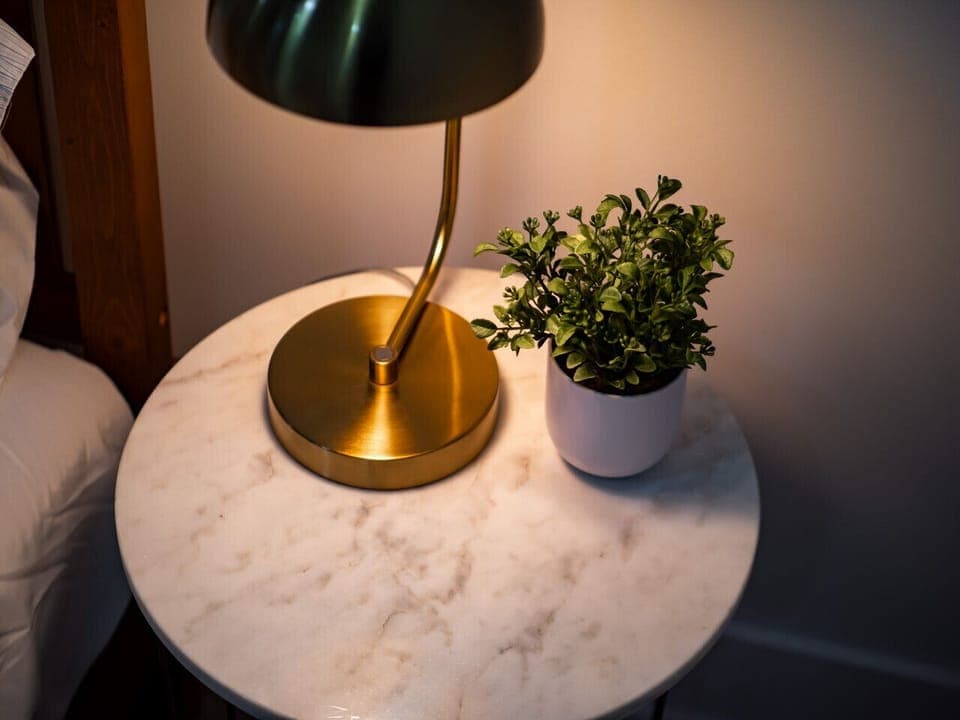 Minimalist vibes.  Clean lines, neutral tones, and a touch of art.  This bedroom is pure bliss.