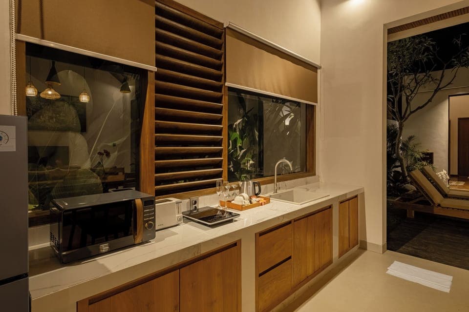 Villa, Patio, Pool View | Private kitchenette | Fridge, microwave, stovetop, dishwasher