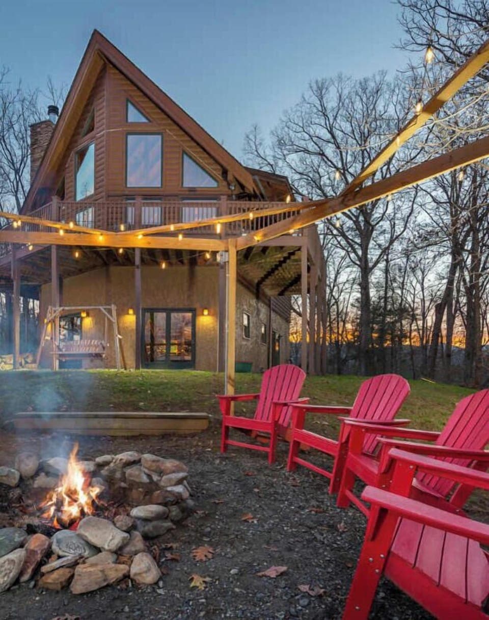 Create unforgettable memories around the firepit, nestled outside the cabin and illuminated by twinkling lights.