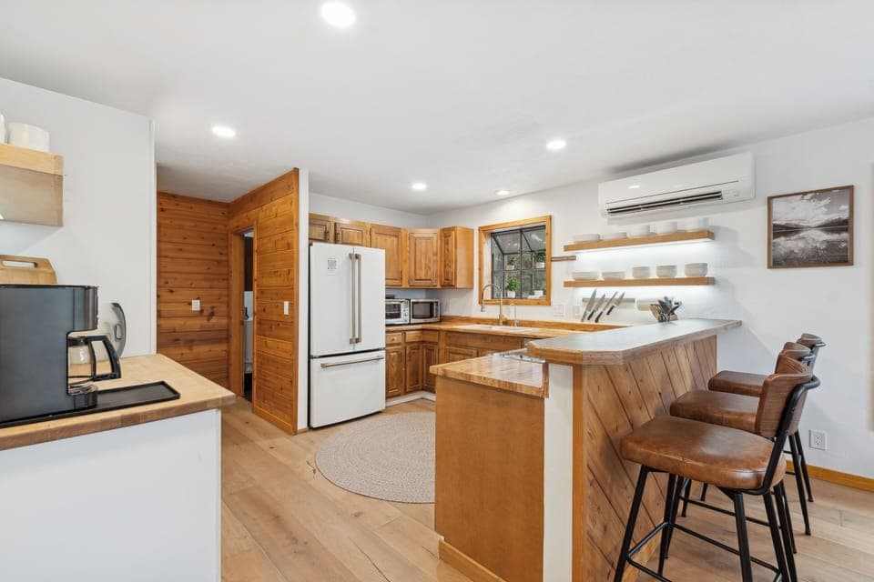 Kitchen is stocked with all necessities to host a sit down dinner for up to 13.