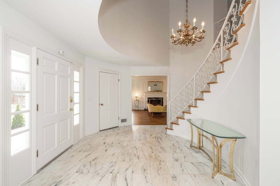 A spacious, elegant entryway will welcome you home