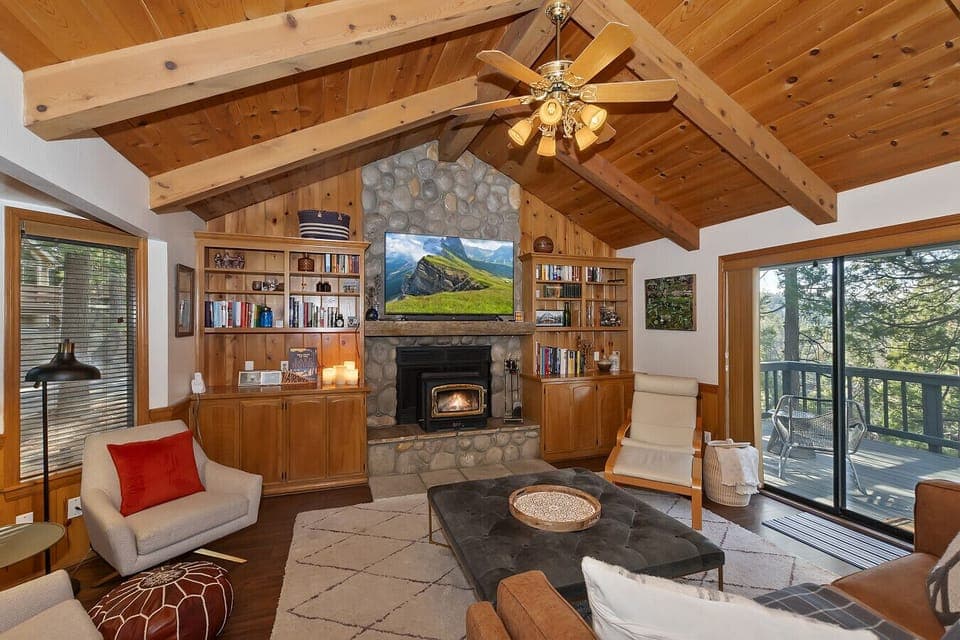 Living room with wood burning fireplace to cozy up to