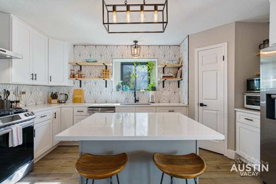 The heart of the home, where culinary creations and good times are shared. This well-equipped kitchen, complete with a spacious island, is perfect for cooking up a storm and gathering with loved ones.