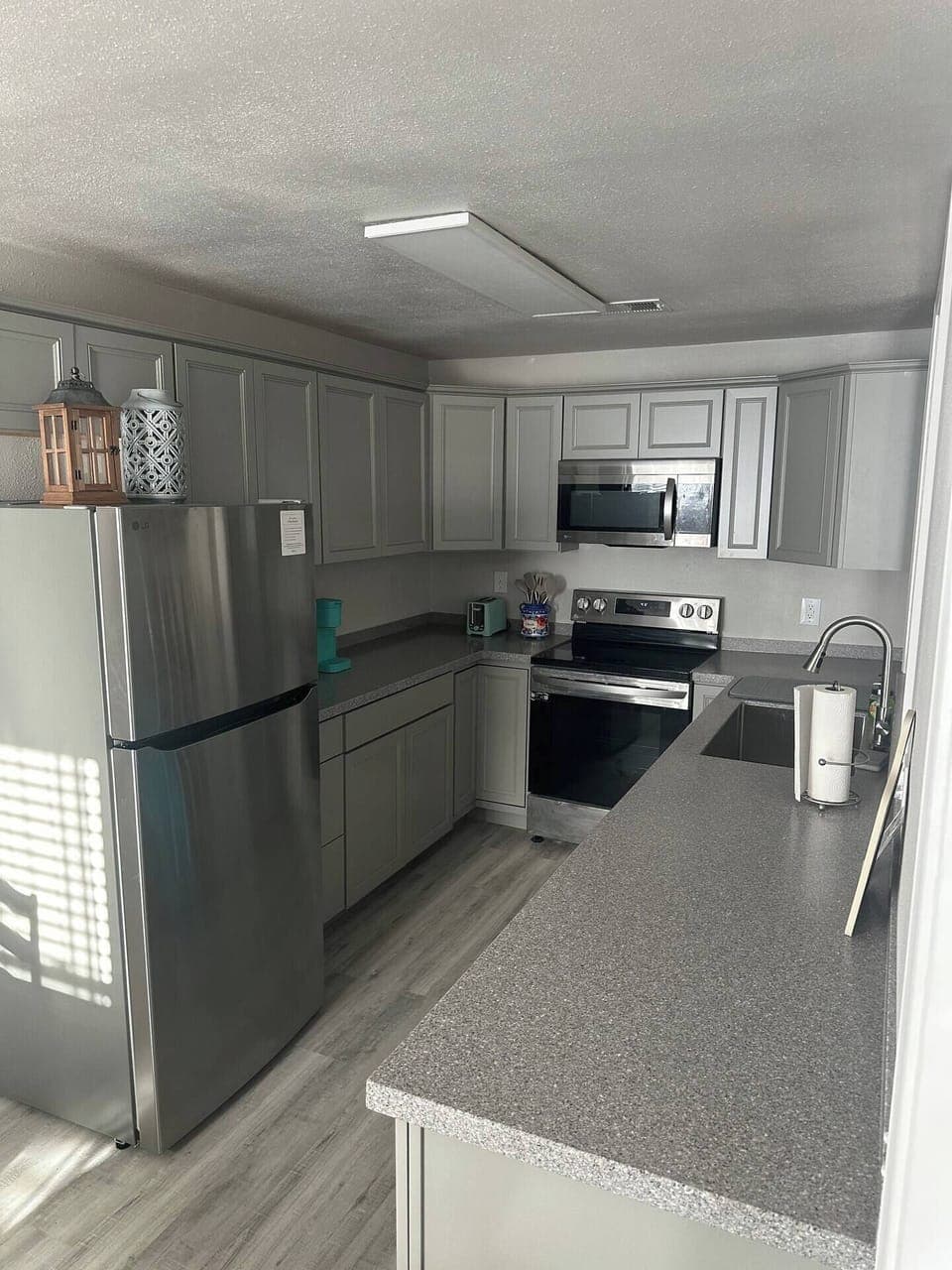 Brand new kitchen with all the dishware, pots/pans, and utensils you’ll need.