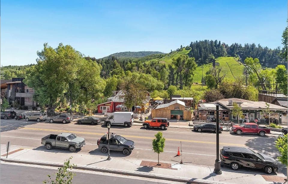 Summer view from window. There is a farmers market on Saturdays on this street.