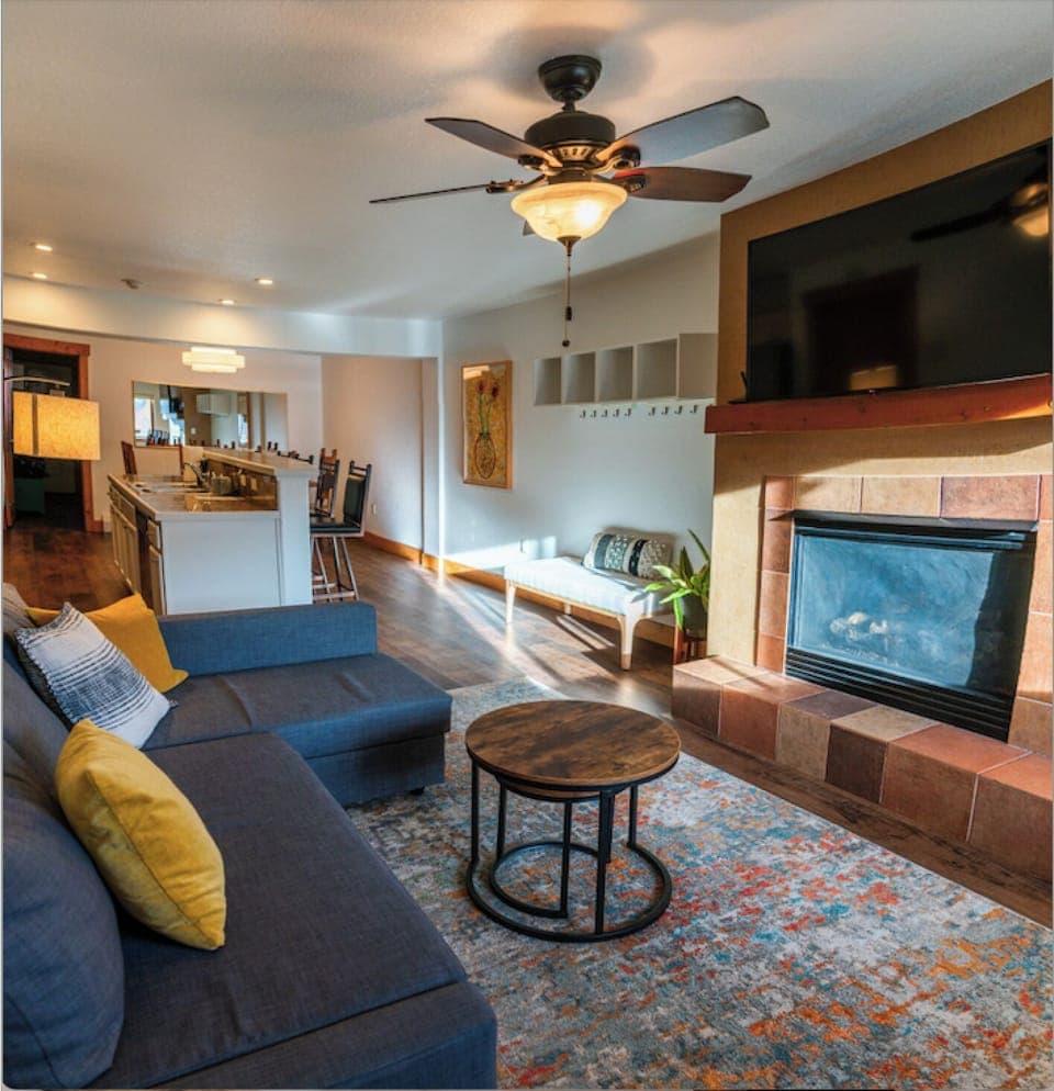 The condo has an open floor plan and a relaxing, modern, minimalist vibe.