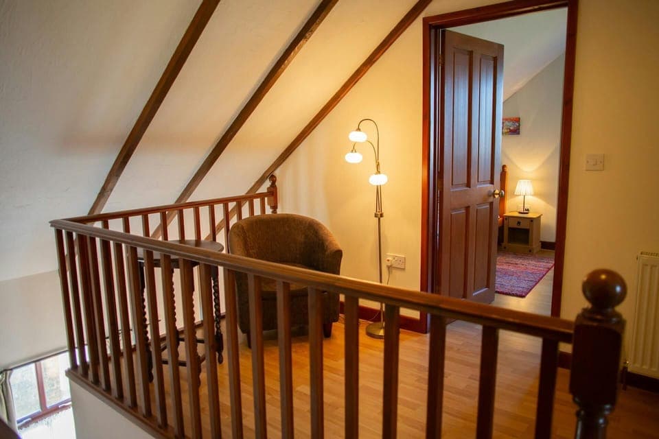 Landing with arm chair and floor lamp