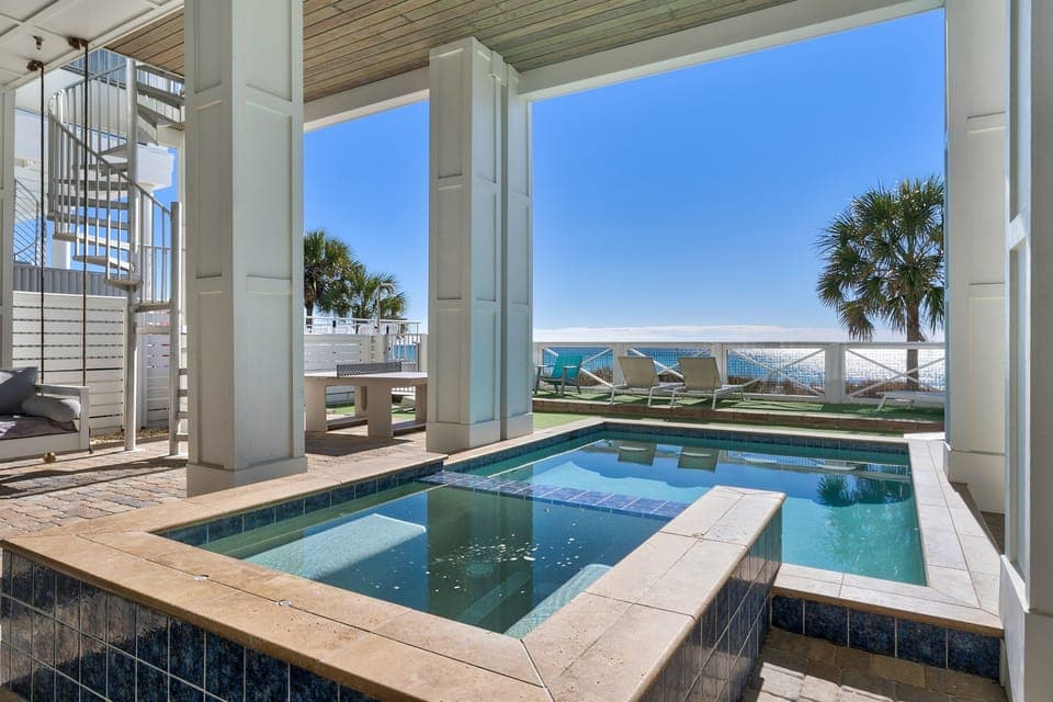 Dive into your private pool while soaking up stunning ocean views and Florida sunshine from this elevated terrace paradise.