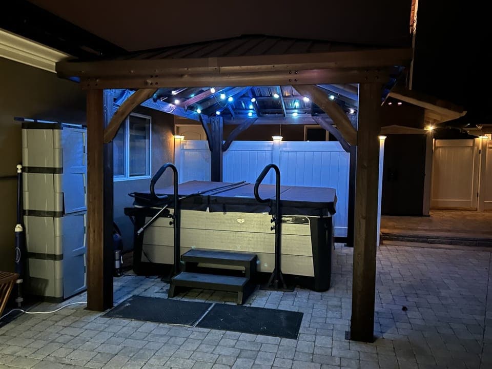 Covered hot tub with overhead mood lighting