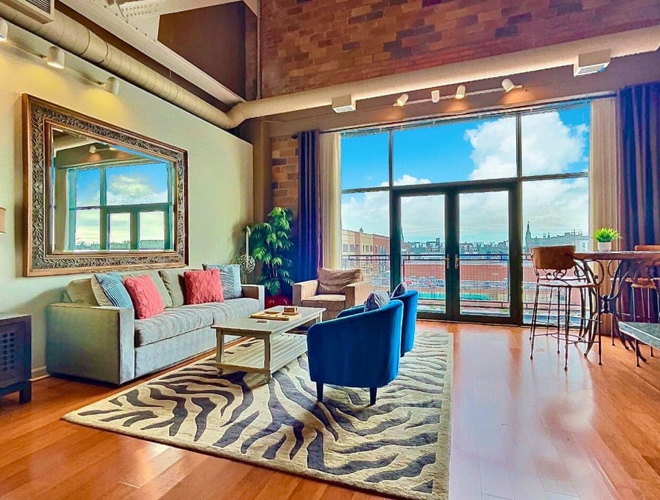 Bright & Airy Living Space
This sunlit living room blends modern comfort with warm, earthy tones. Floor-to-ceiling windows provide stunning views, while plush seating invites you to relax in style.
