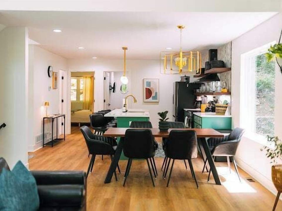 Chic Dining and Kitchen: Modern design meets nature with vibrant decor and ample dining space!