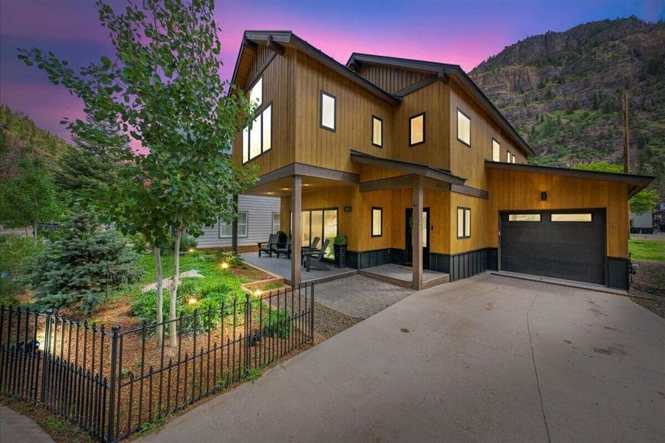 Front of house. 2-car tandem driveway and garage to store gear. 