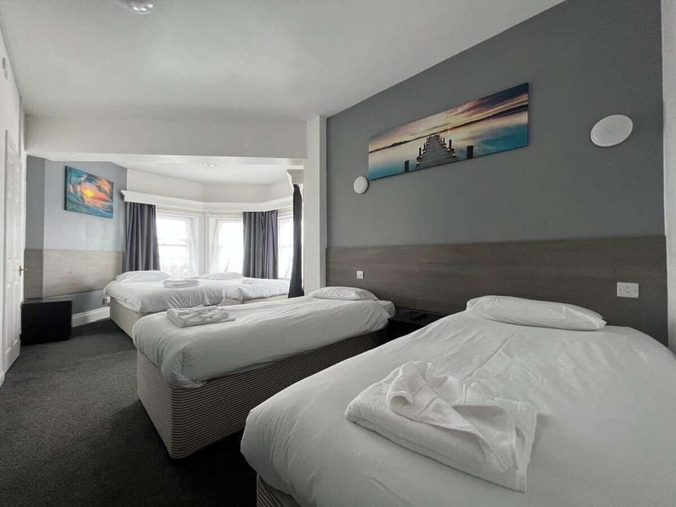 Deluxe Quadruple Room, City View | Blackout drapes, iron/ironing board, free WiFi