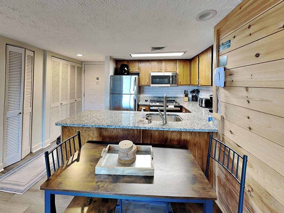 Fully Equipped Kitchen + Dining Area with Seating for Four