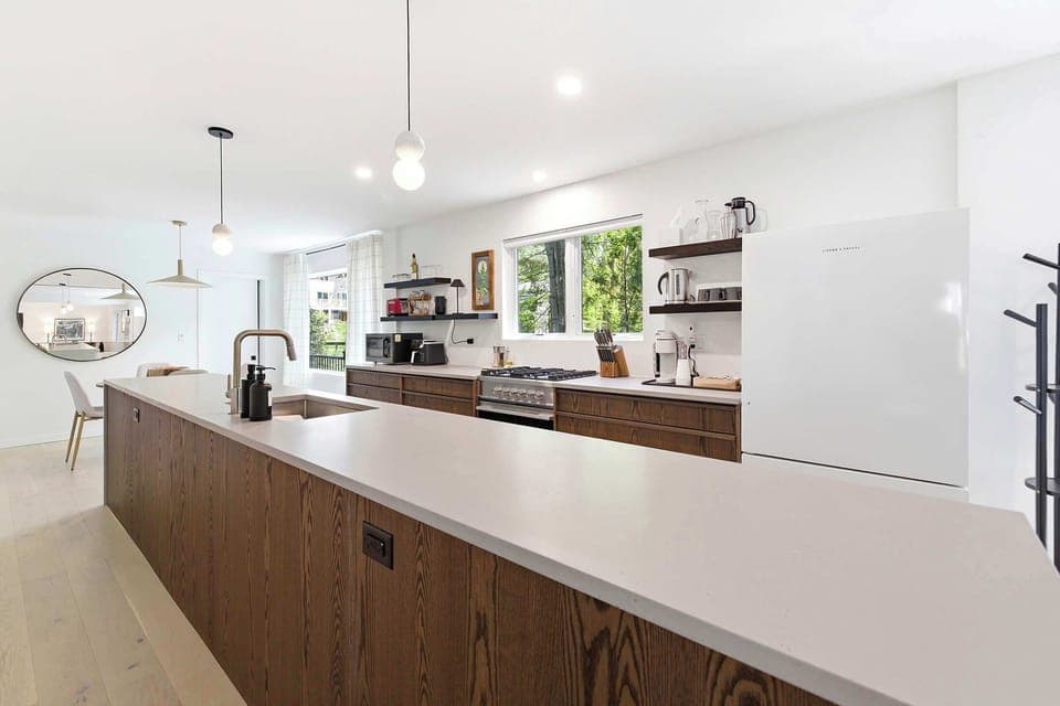 Clean lines, warm tones, and a kitchen that’s ready for cooking and compliments.