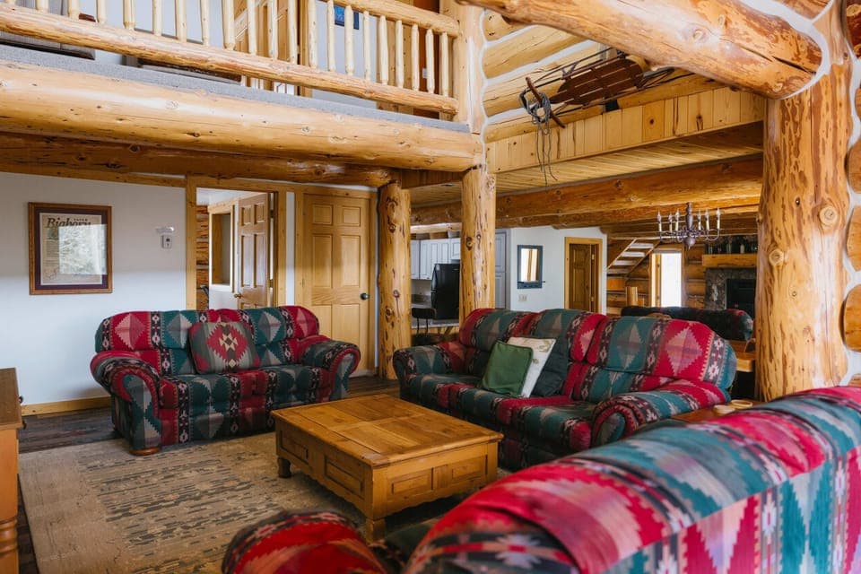 Living Room 1 (main floor): Smart TV, forest views