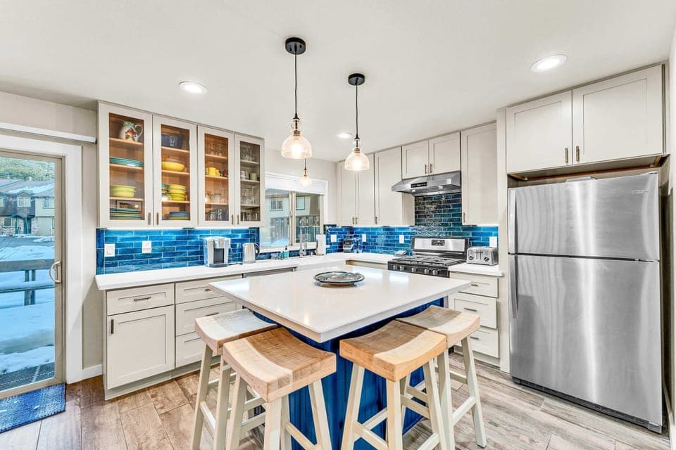 Kitchen: Keurig coffee maker, Crockpot, blender, cooking utensils, tableware