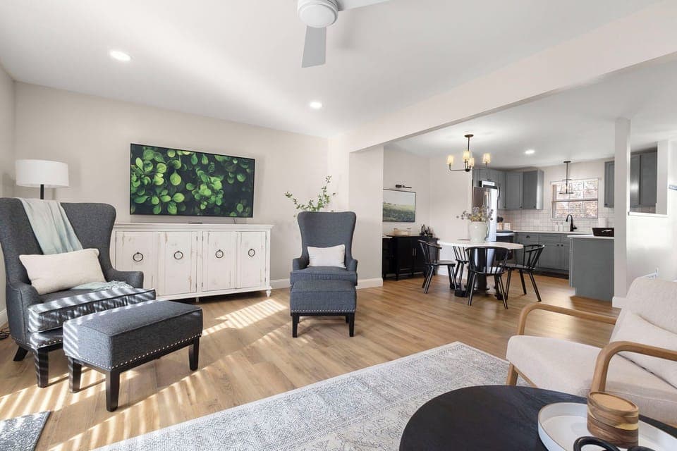 Equipped with a 65" smart tv, plenty of seating, lots of light, & board games.