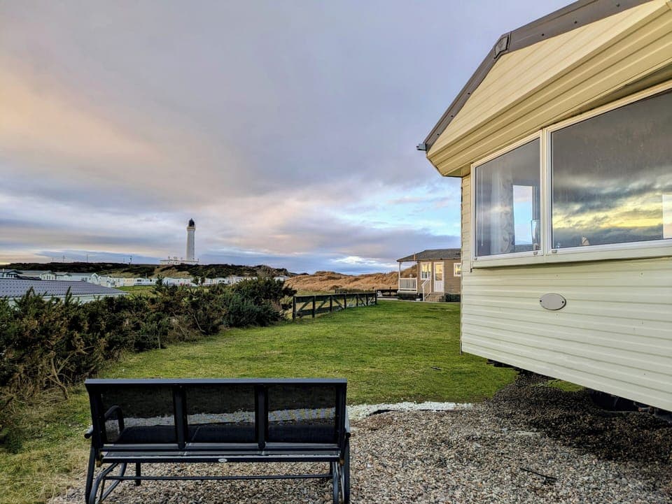 Stunning lighthouse and dune views from your peaceful caravan pitch.