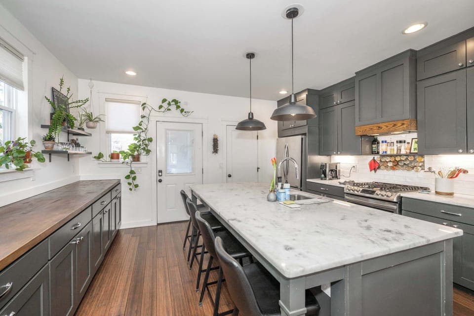 The elegant, open kitchen offers ample space & all the comforts of home