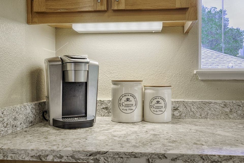 Coffee maker, coffee pods, and sugar for your use