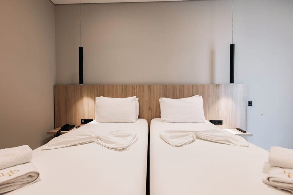 Deluxe Double or Twin Room, Balcony, Partial Sea View | Minibar, in-room safe, desk, blackout drapes