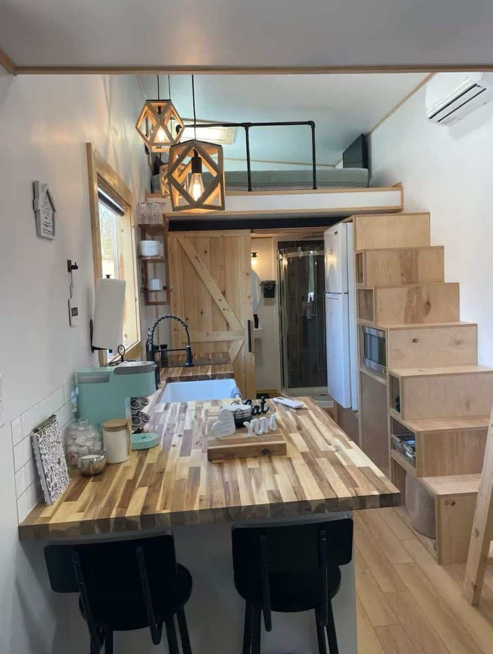 Stylish Kitchen: Enjoy culinary adventures with chic decor, stunning wood accents, and vibrant lighting!