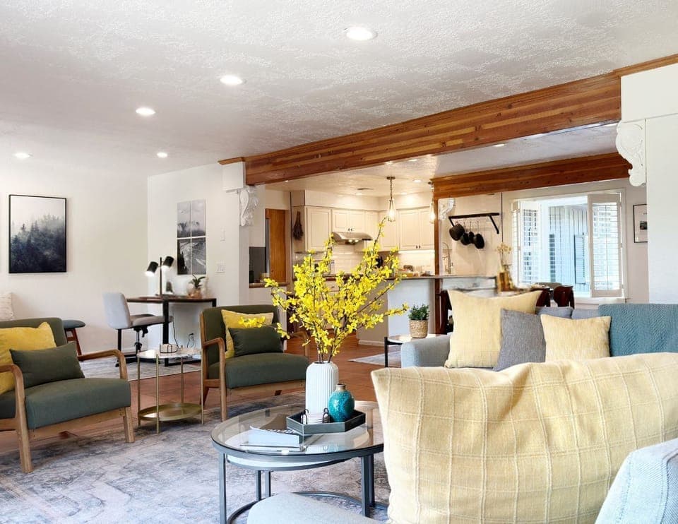 An open layout connects the living room to the office, kitchen and dining room.