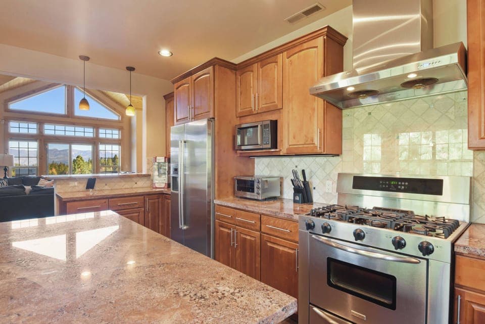 Full kitchen with toaster oven, coffee maker, blender, kitchen aid mixer and more