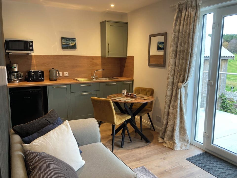 Ninja Air fryer, microwave, filter coffee machine, toaster, fridge and kettle.