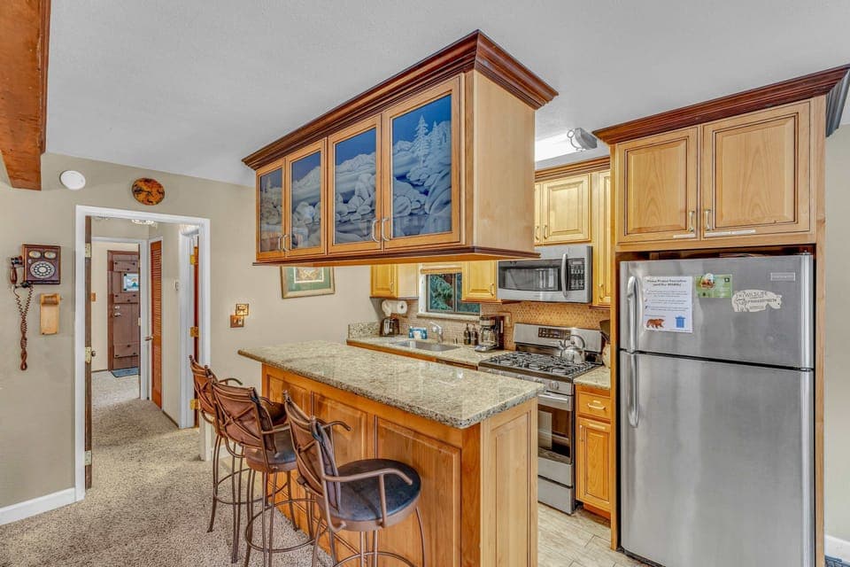 Kitchen: Main floor, drip coffee maker, Crockpot, toaster, cooking utensils