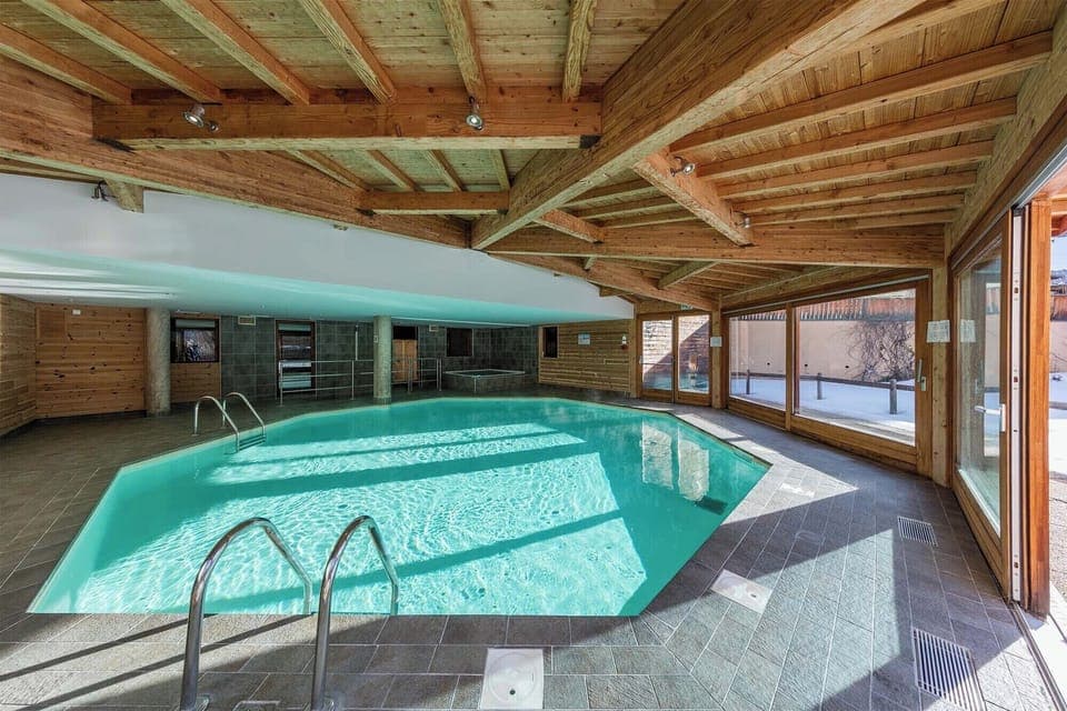 The indoor heated pool, bathed in natural light, offering a perfect spot to relax after a day on the pistes.