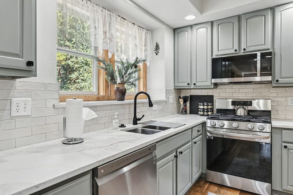 Kitchen with gas range/oven, microwave and dishwasher