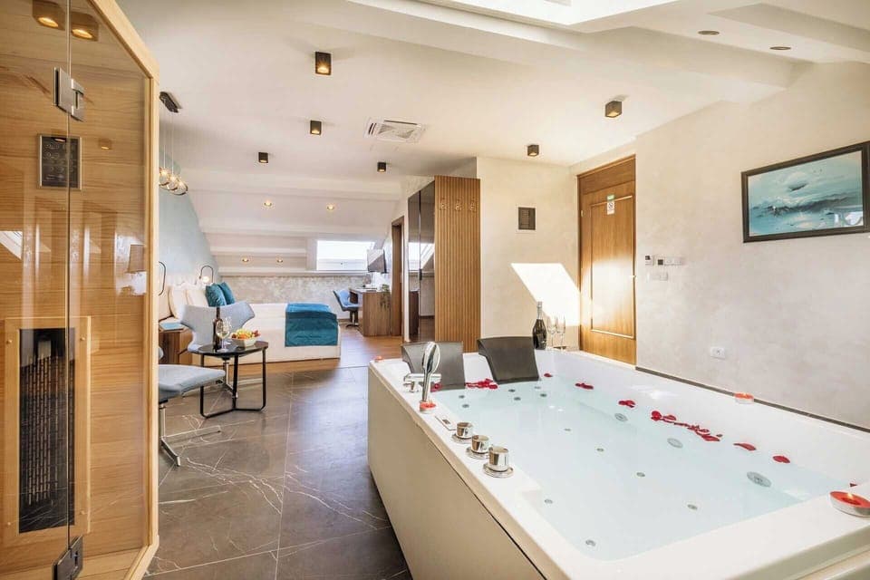 Luxury Studio Suite, Sea View | Minibar, in-room safe, desk, laptop workspace