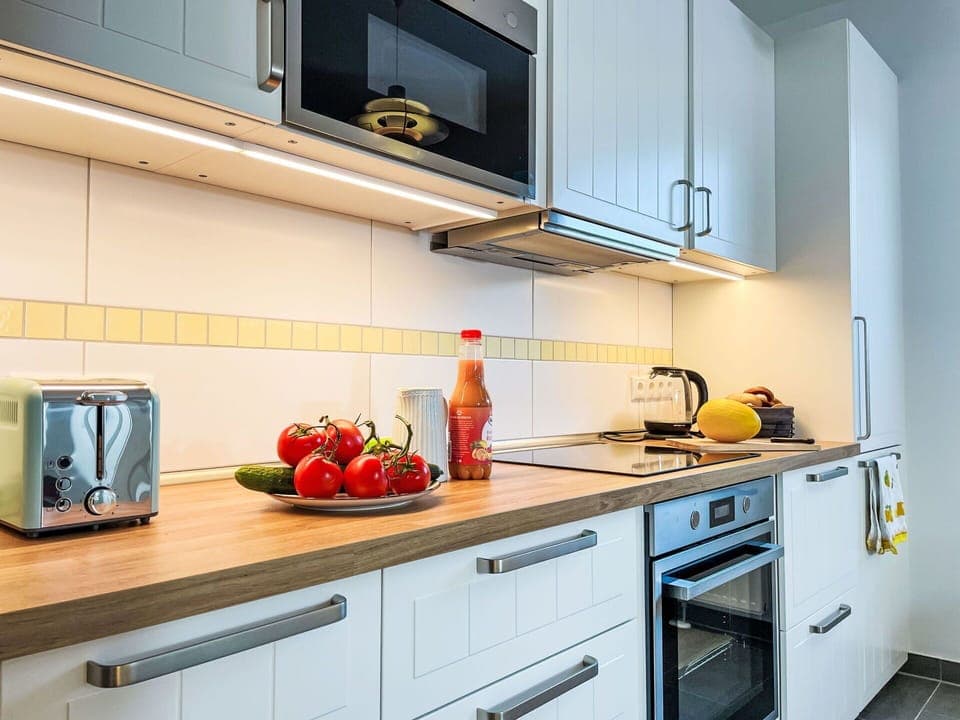 Kitchen, Kitchen Appliance, Countertop, Major Appliance, Home Appliance, Cabinetry, Interior Design, Wood, Flooring, Lighting