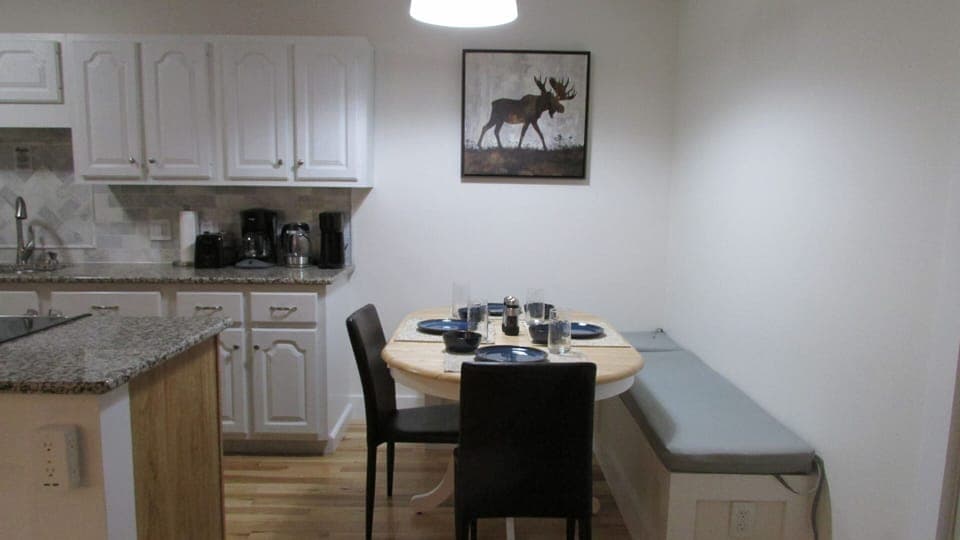 Dining area with additional bar seating on island