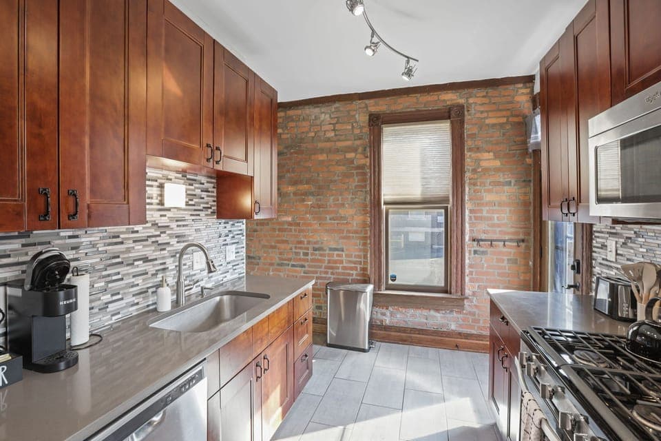 Kitchen with gas range.